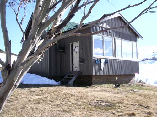 Illawong Lodge with a snow gum and washing hung out the front